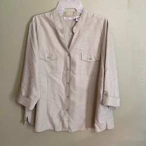 3/4 length button up shirt. Fabric is soft and smooth